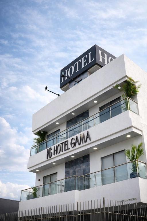a hotel with a sign on top of it at Hotel Gama Cartagena in Cartagena de Indias