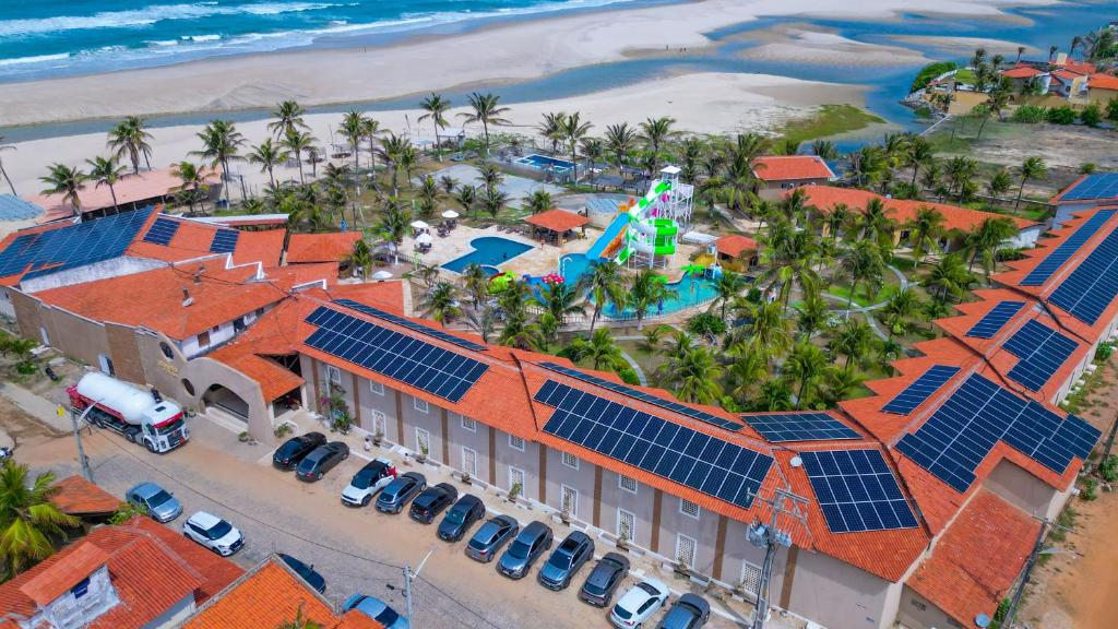 an aerial view of a resort with solar panels on its roofs at Jangadeiro Praia Hotel Resort - Parque Aquático e Pé na Areia in Aquiraz
