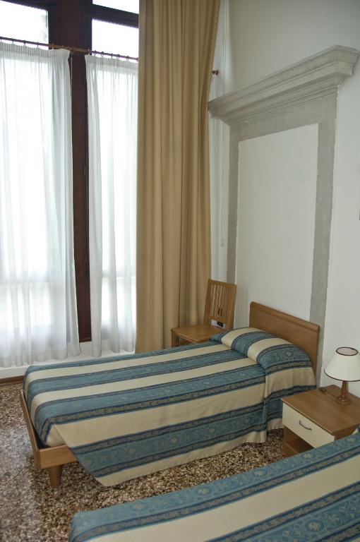Postel nebo postele na pokoji v ubytování Casa Sant'Andrea