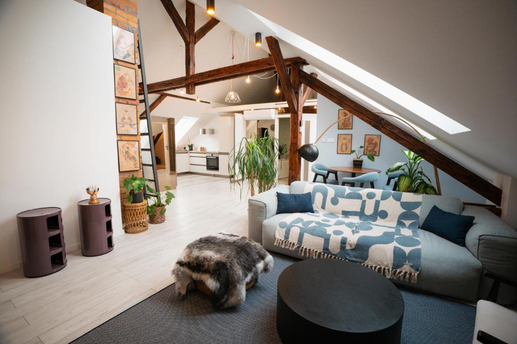 a living room with a couch and a table at Premium Design Loft - Old Town in Košice