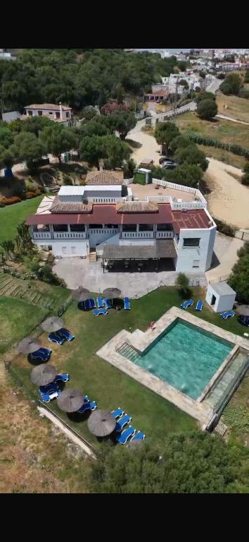 an aerial view of a large building with a swimming pool at Hostal Restaurante Benalup Golf in Benalup Casas Viejas