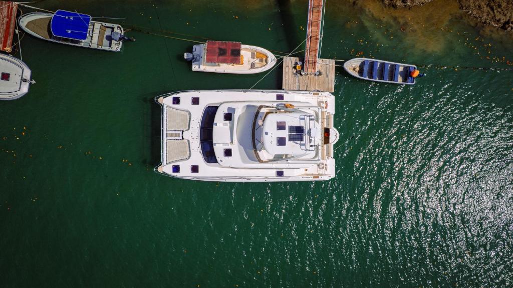 a boat is docked in a body of water at Garden Level Studio in Mtwapa