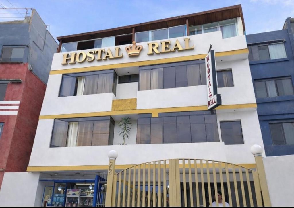 a building with a hospital real sign on it at Hostal Real in Lima