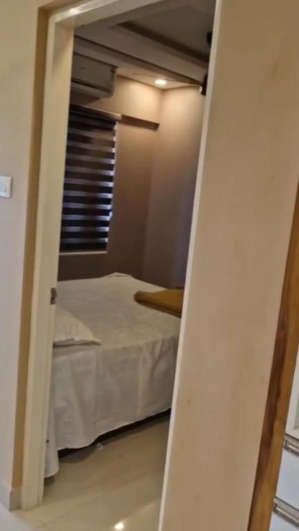 a view of a room with a bed and a mirror at D D Highway gate in Cochin