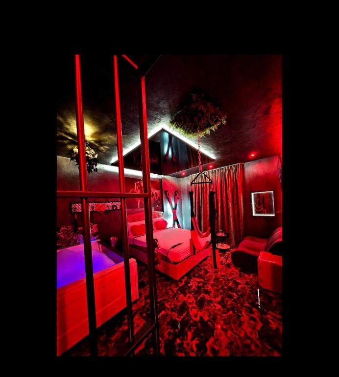 a bedroom with two bunk beds and a couch at bucharest love room in Bucharest
