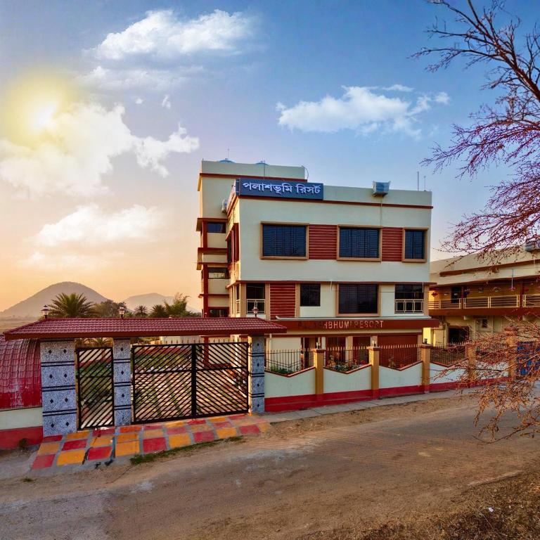 a building with a sign on top of it at Palashbhumi Resort in Barhanti