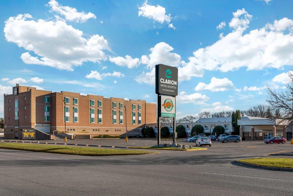 a sign in a parking lot in front of a building at Clarion Hotel & Suites in Brandon
