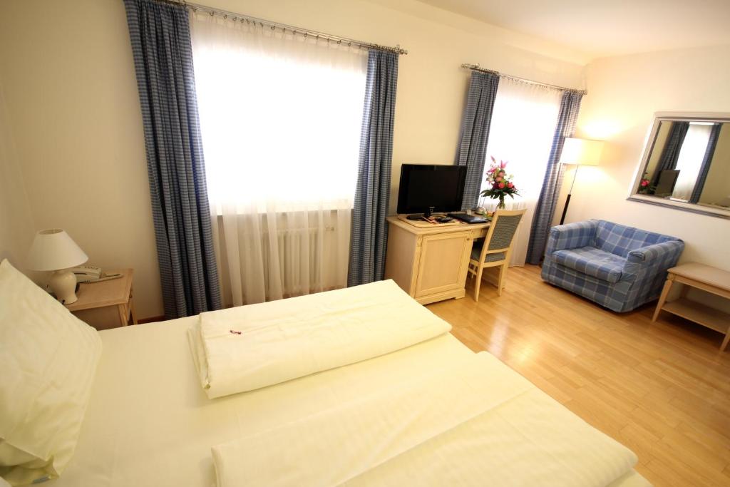 Posteľ alebo postele v izbe v ubytovaní Carinthia Stadthotel