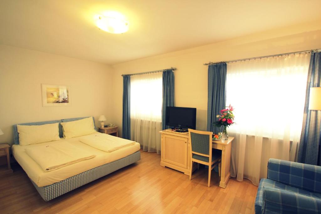 Posteľ alebo postele v izbe v ubytovaní Carinthia Stadthotel