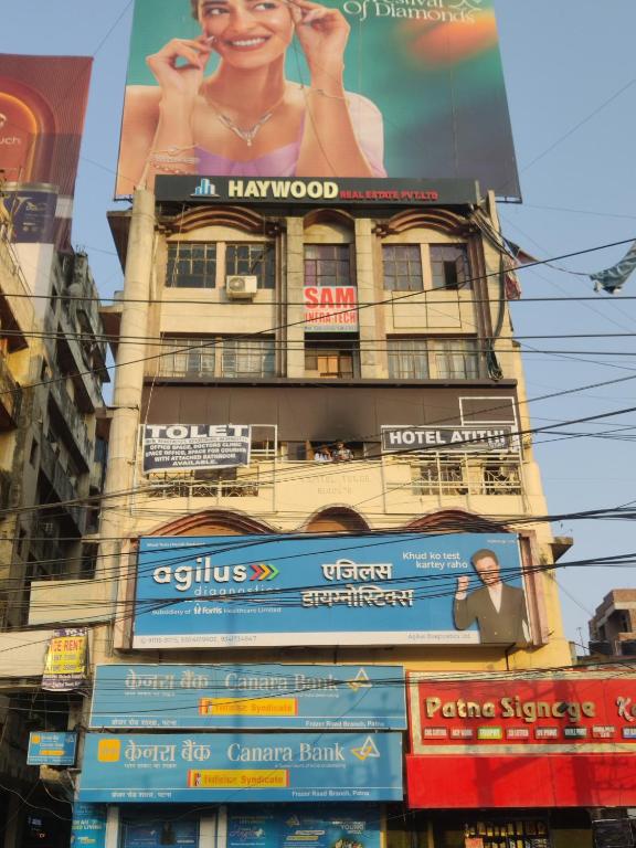 a building with a billboard on the side of it at Atithi Stay in Patna