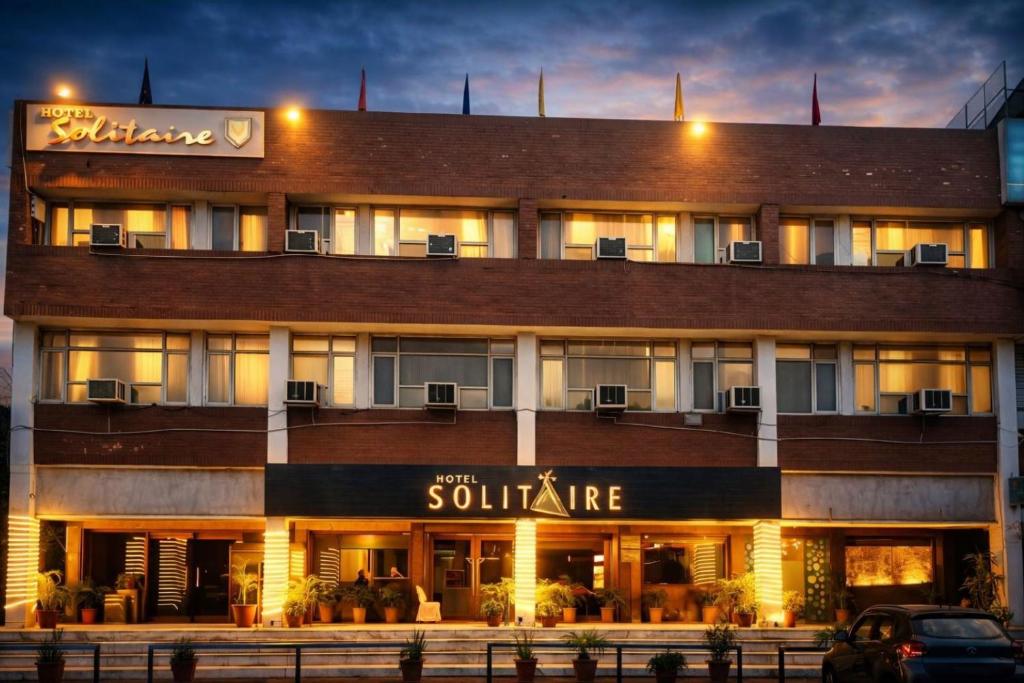 a building with a sign for a hotel at Hotel Solitaire Chandigarh - 10 Mins from Railway Station in Chandīgarh