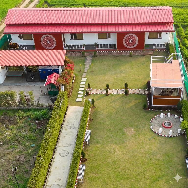 an aerial view of a house with a yard at Eeja Resto and Cafe in Garappu