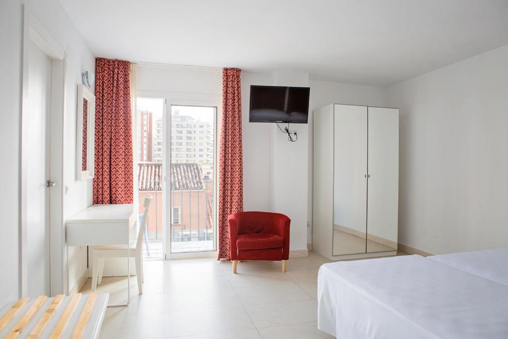 Postel nebo postele na pokoji v ubytování Hotel Eliseos