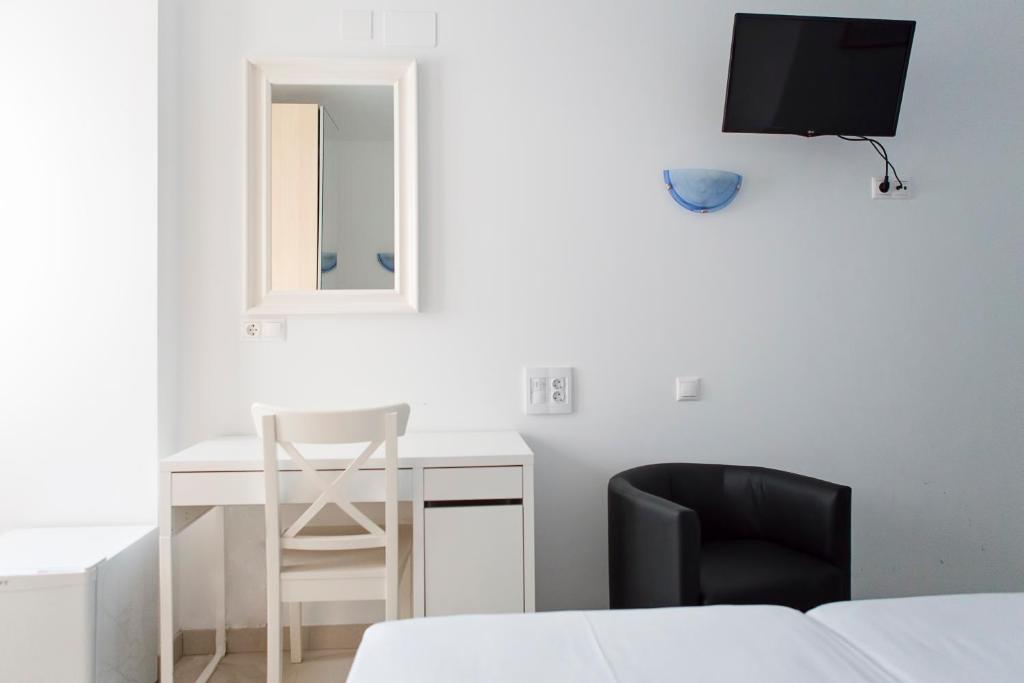 Postel nebo postele na pokoji v ubytování Hotel Eliseos
