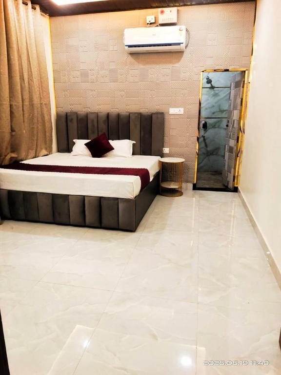 a bedroom with a bed in a room at RK Residency in Ayodhya