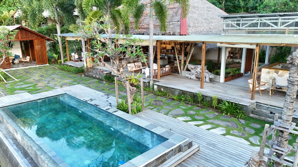 an aerial view of a house with a swimming pool at D'Lagoon Dive Resort in Bitung