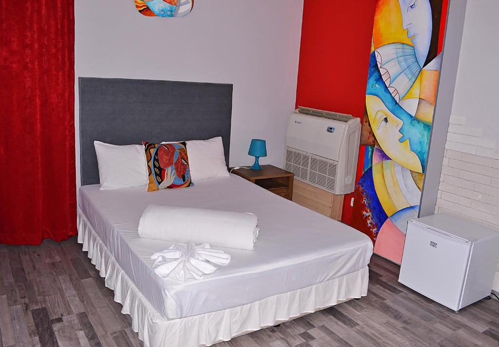 A bed or beds in a room at Art Hotel Simona