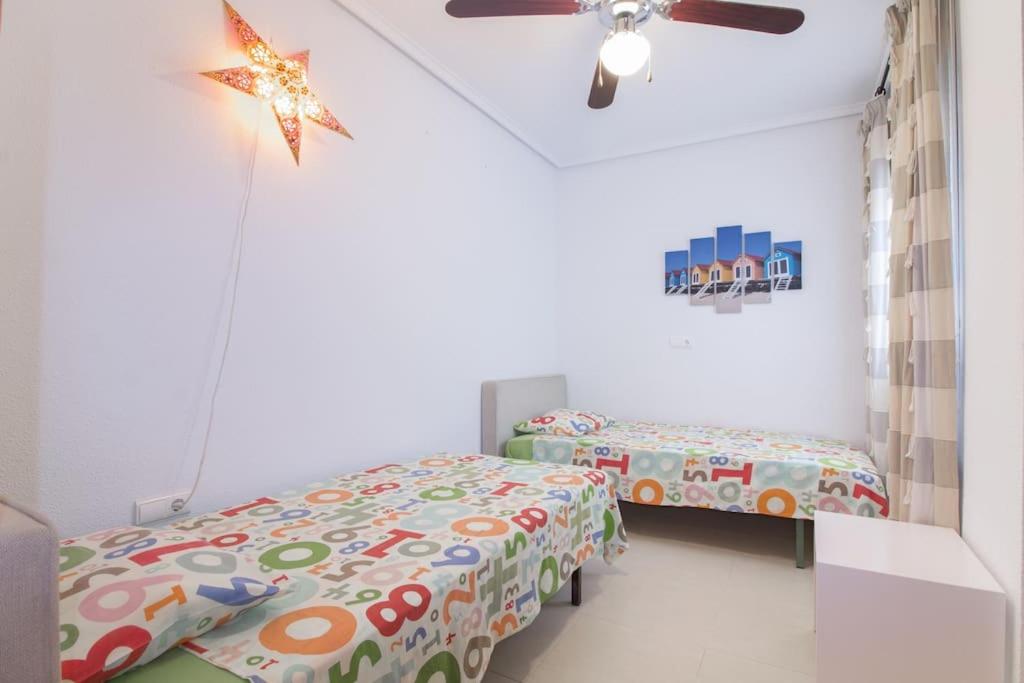 A bed or beds in a room at Brisa del Mar