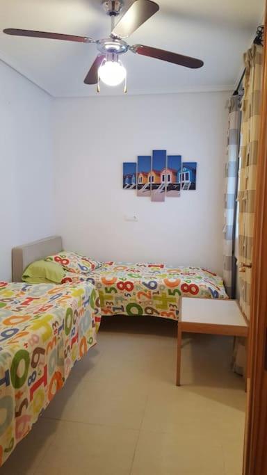 A bed or beds in a room at Brisa del Mar