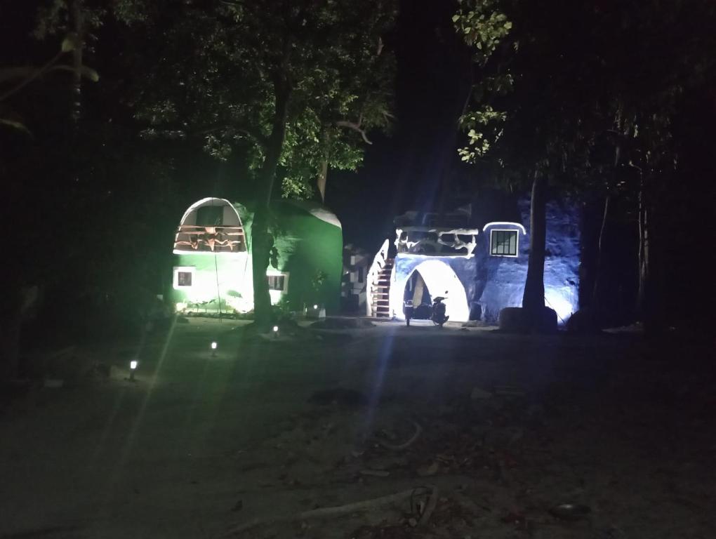 a group of camels parked in a field at night at Art rock garden in Ko Lipe