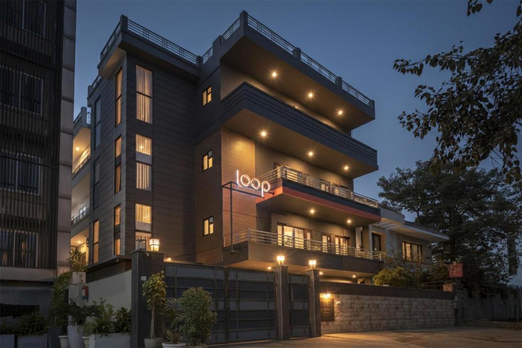a building with a sign on the front of it at Loop by Zolo Baani Square, Gurugram in Gurgaon
