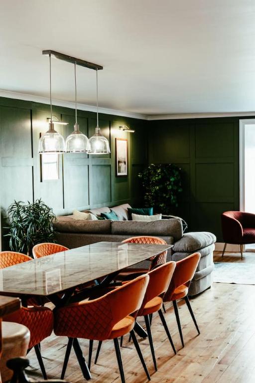 a living room with a table and chairs at The Seadoor, Shetland Islands in Lerwick