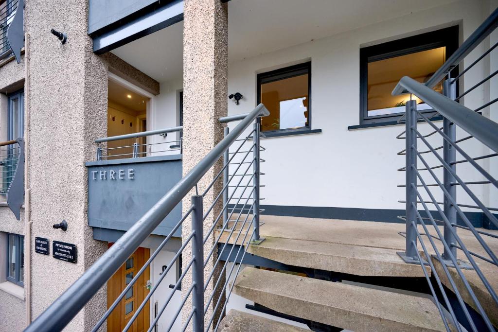 a staircase leading up to a building with windows at Riverside Park 3 in Keswick