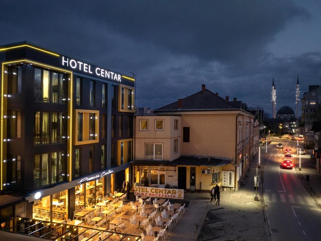 a hotelcentury building on a city street at night at Hotel Centar Sanski Most in Sanski most