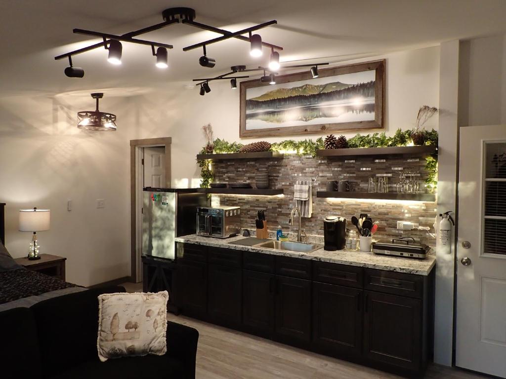 a kitchen with a counter with a sink in it at Private White Mountains Guest Suite - Welcome! in Littleton