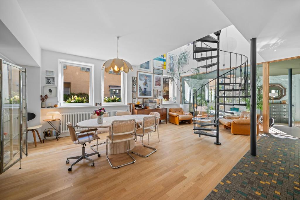 a large living room with a table and chairs at Maison Nice - Plage 300m - Parking in Nice