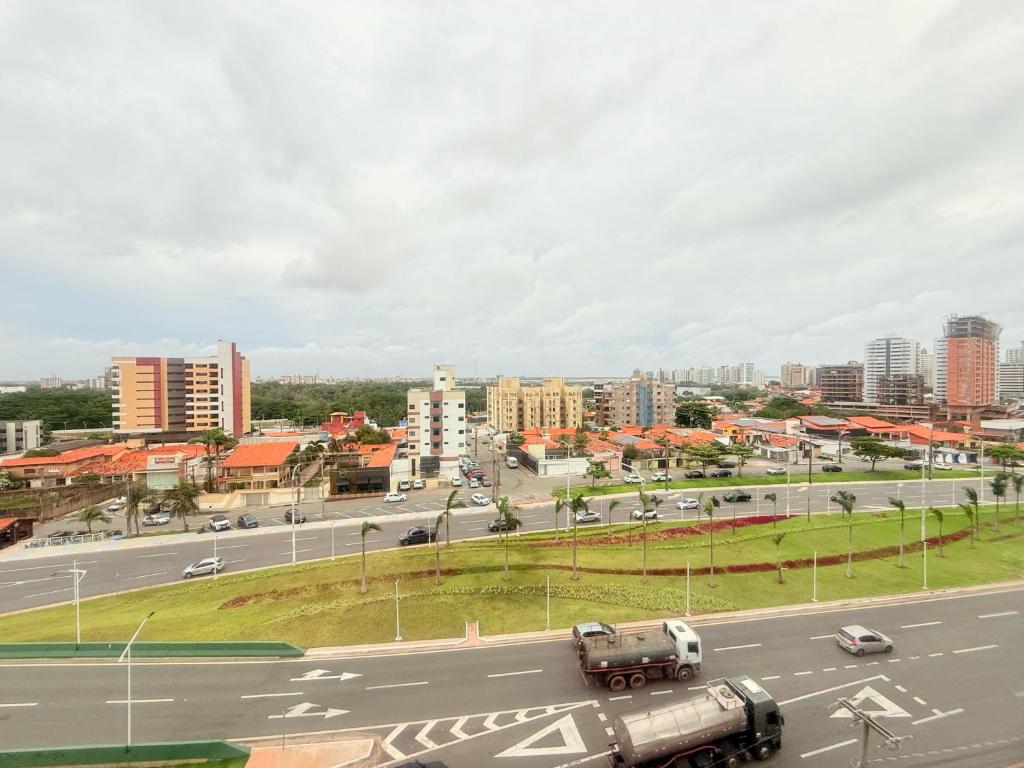 a view of a highway with a city in the background at Biarritz praia in São Luís
