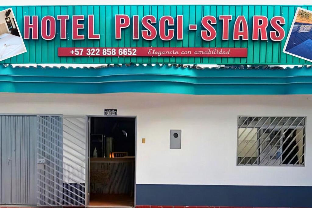 a hotel sign on the side of a building at Hotel Pisci Stars Sra in Saravena