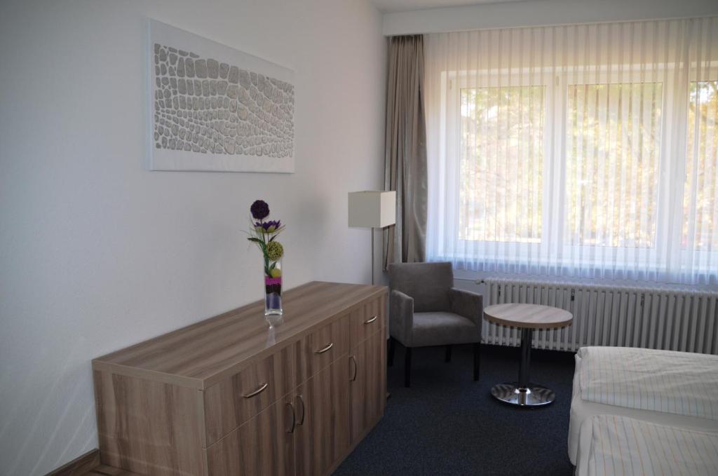 Postel nebo postele na pokoji v ubytování Gästehaus Pauline