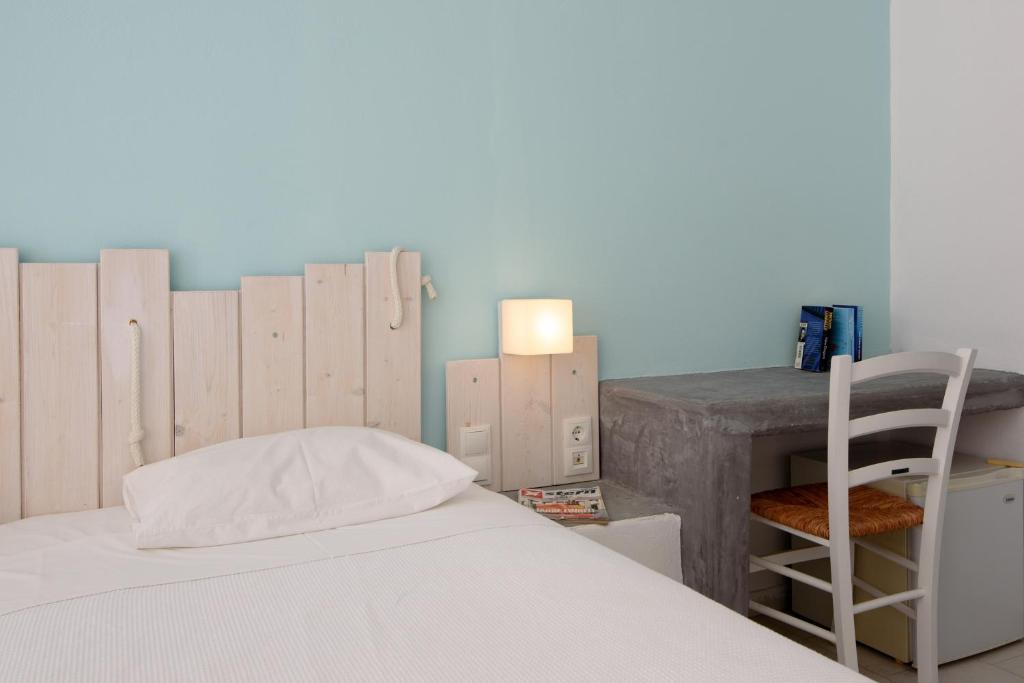 Postel nebo postele na pokoji v ubytování Iris Boutique Hotel