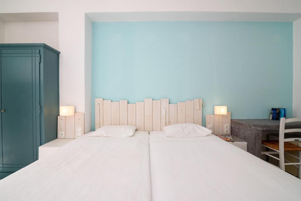 Postel nebo postele na pokoji v ubytování Iris Boutique Hotel