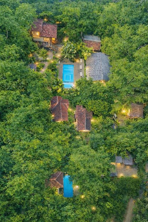 an overhead view of a house with a blue door at Le Eden Premium Wayanad Pool Resort in Sultan Bathery