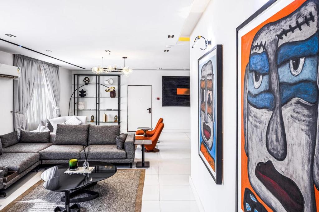 a living room with a couch and a table at Eterniti by Amber in Lagos