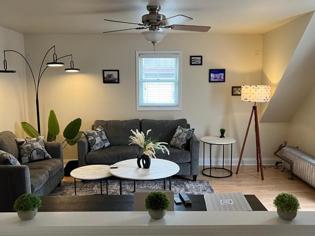 a living room with a couch and a table at Sexy Suite in Cedarburg