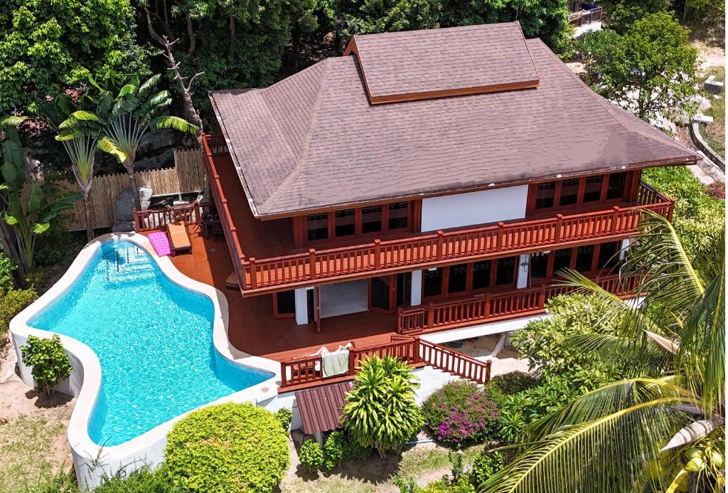 an aerial view of a house with a swimming pool at Villa Vadee - Entire Private Villa, 4 Bedrooms, Large Swimming Pool, Ocean View in Thong Nai Pan Noi