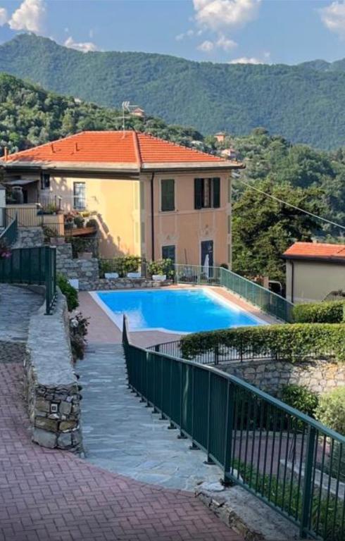 a house with a swimming pool in front of it at Villa Goga in Ruta