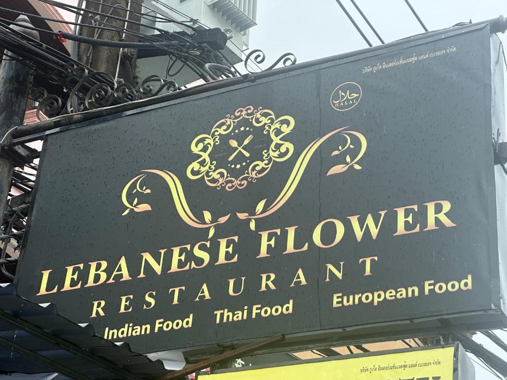 a sign for a lebanese flower restaurant at Luxus Grand Hotel in Patong Beach