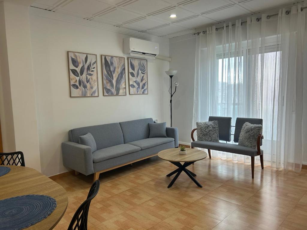 a living room with a couch and a table at Entrevías in Albacete