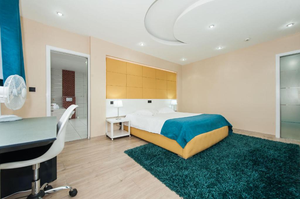 Postel nebo postele na pokoji v ubytování Hotel Phenix