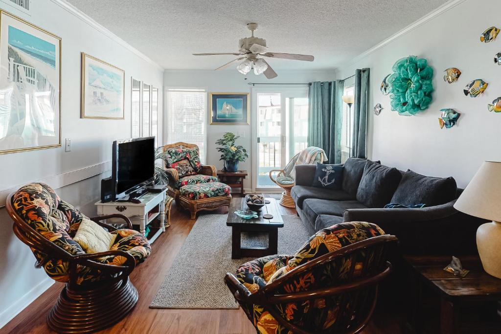 a living room with a couch and chairs at ABSS102 Seaspray 224 in Atlantic Beach