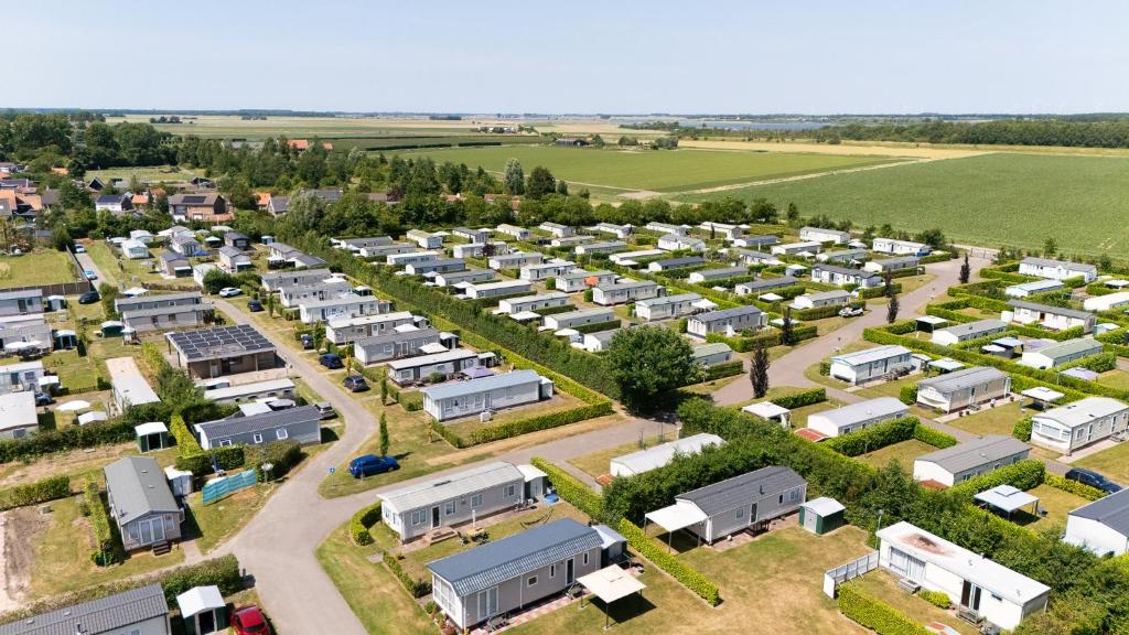 an aerial view of a building complex with trailers at Camping de Haas in Wolphaartsdijk