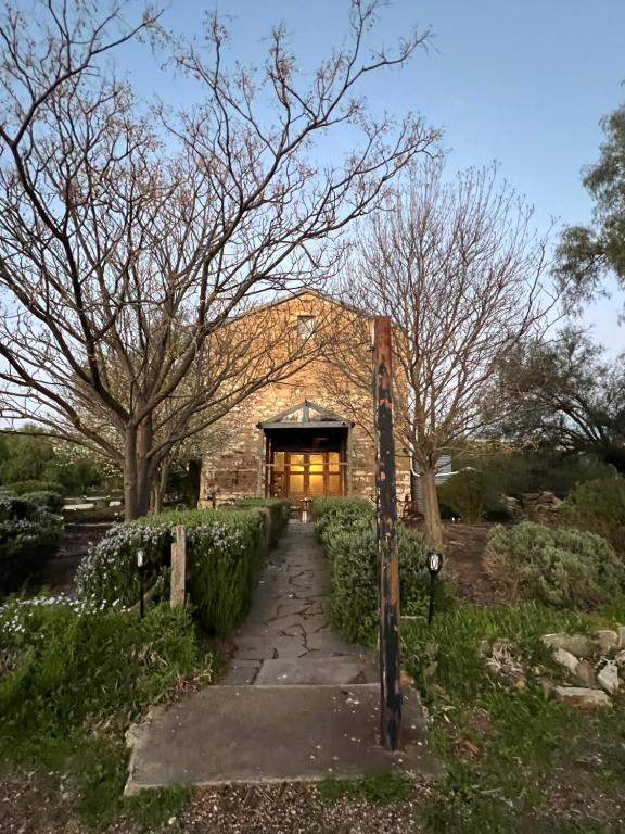 a building with a pathway in front of it at Butterworth Mill in Burra