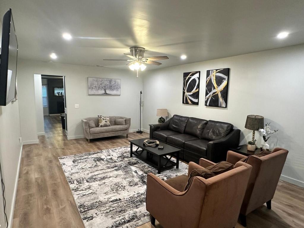 a living room with a couch and a table at NEW Modern Retreat in Richardson