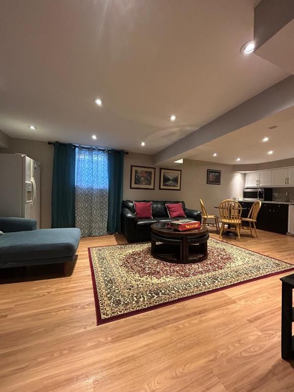 a living room with a couch and a table at 2 Bedroom 1 Bathroom Basement Suite in Toronto