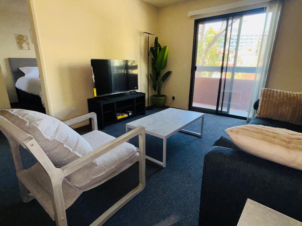 a living room with a couch and a tv at 1Bd Prime Westwood Location One Block from UCLA in Los Angeles