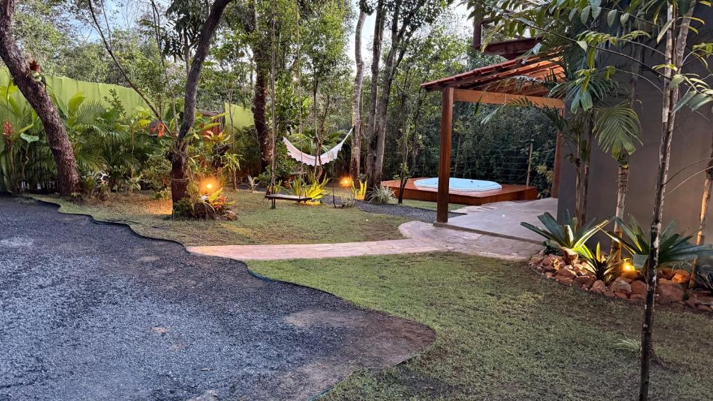 a backyard with a bed and a gazebo at Casa.dovale2 in Caeté-Açu
